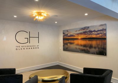 Indoor Sign GH The Residences At Glen Harbor Sign In Room With Painting And Fancy Ceiling Lights