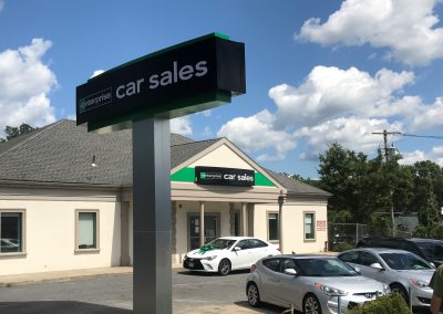 Enterprise car sales sign and office in the background