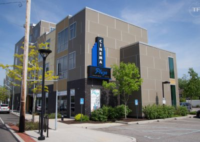 Cinema Plaza Sign Far Daytime Shot With lights Off
