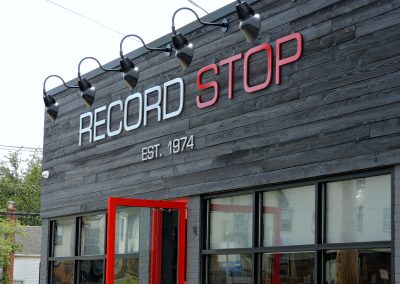Record Stop Sign Above Store
